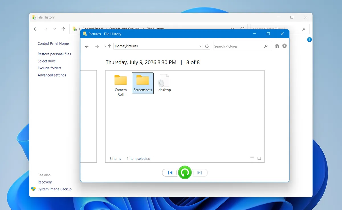 File History restore view showing the Pictures backup with the Screenshots folder selected